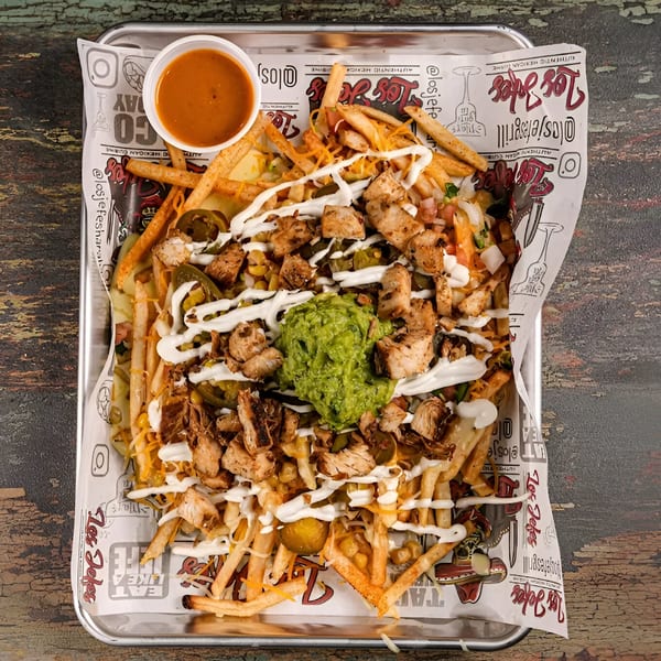 Los Jefes Grill's loaded fries with chicken, cheese, jalapeños, sour cream, and guacamole.